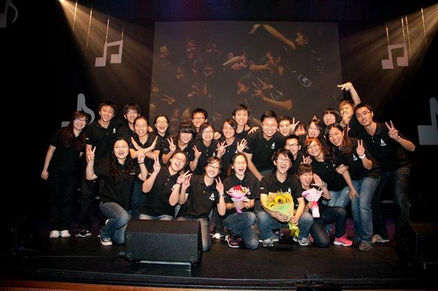 Group photo on stage after performance