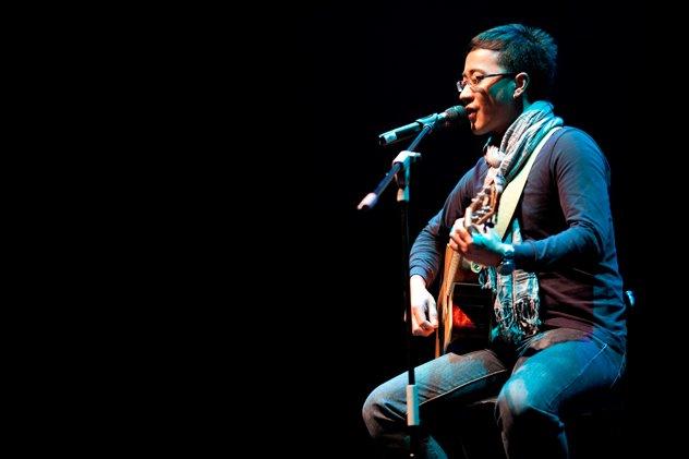 solo musician performing live with guitar